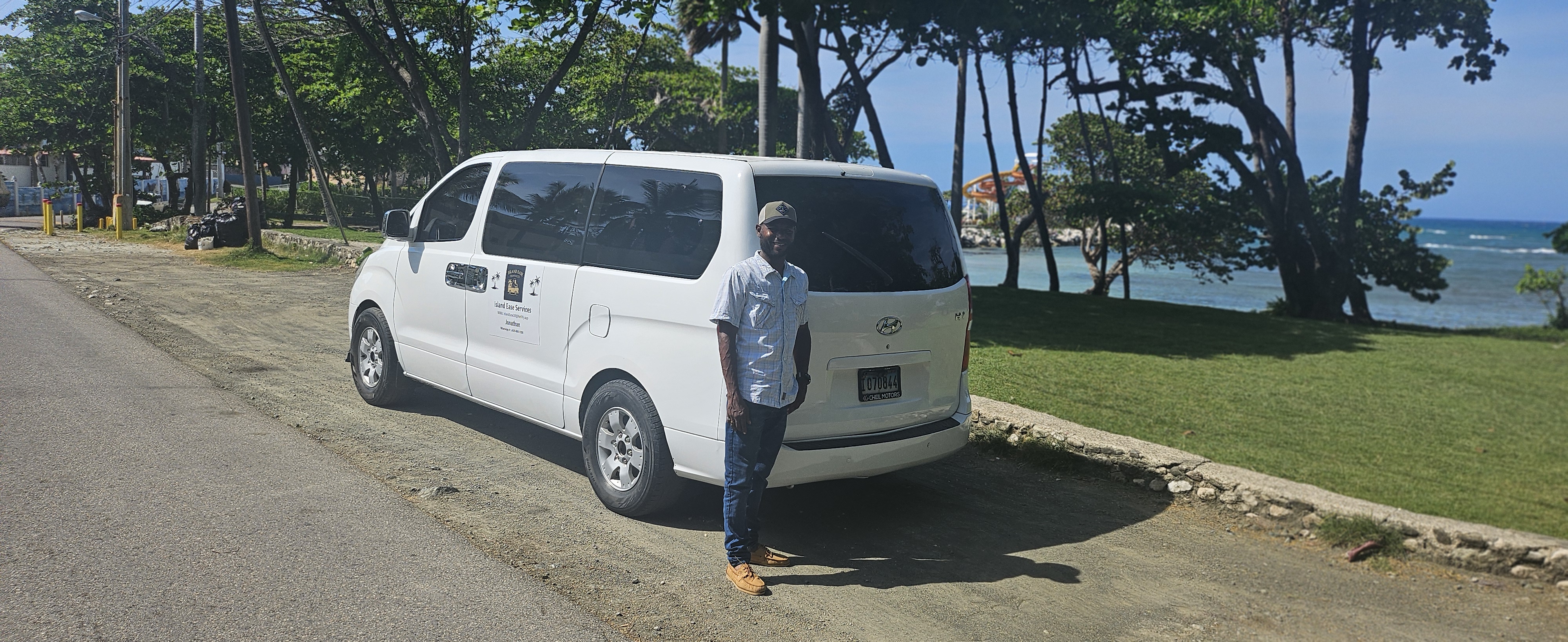 Jonathan standing by the Island Ease private A/C van